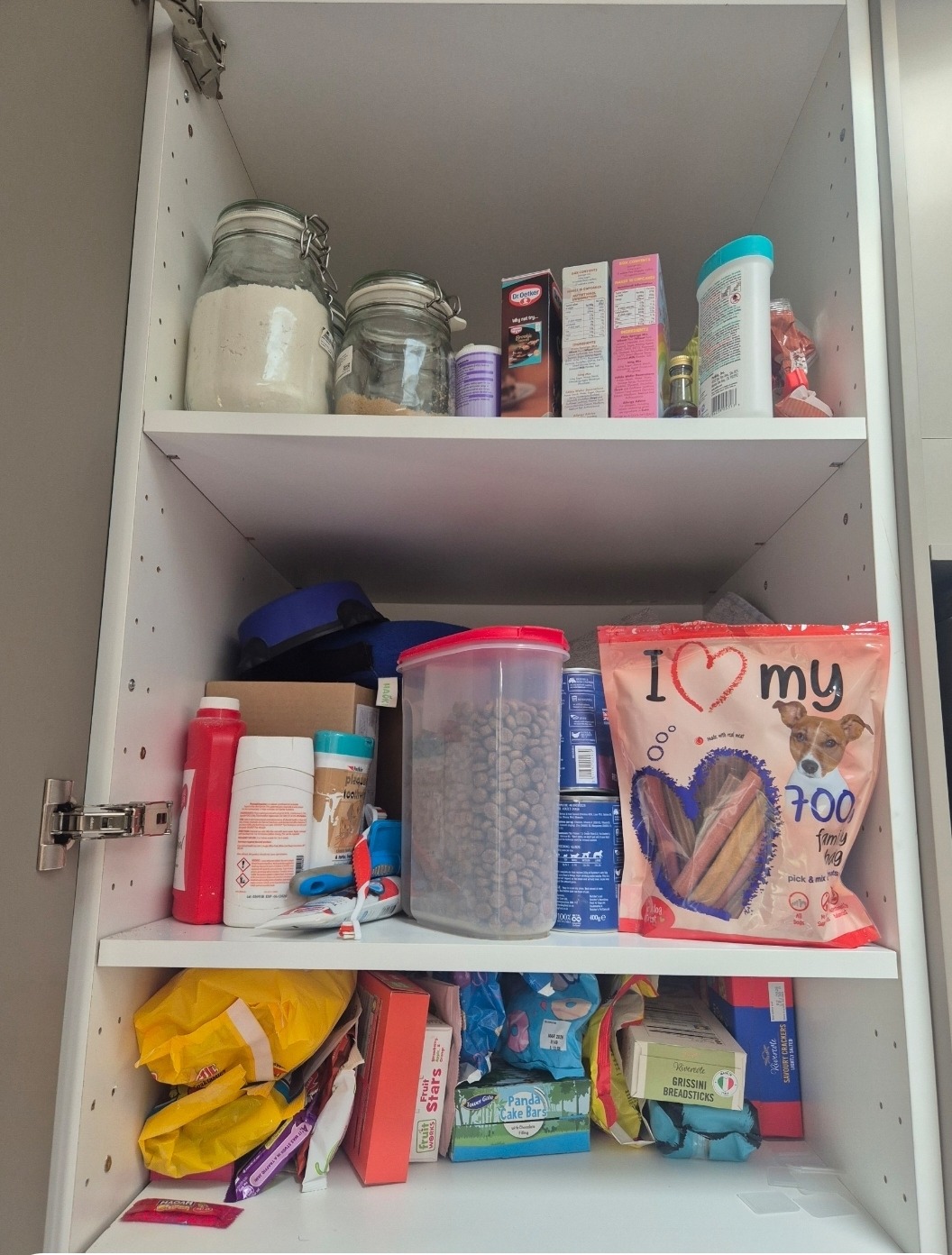 A disorganised kitchen cupboard